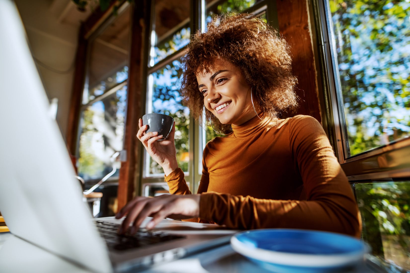 Woman tests a responsive website on laptop