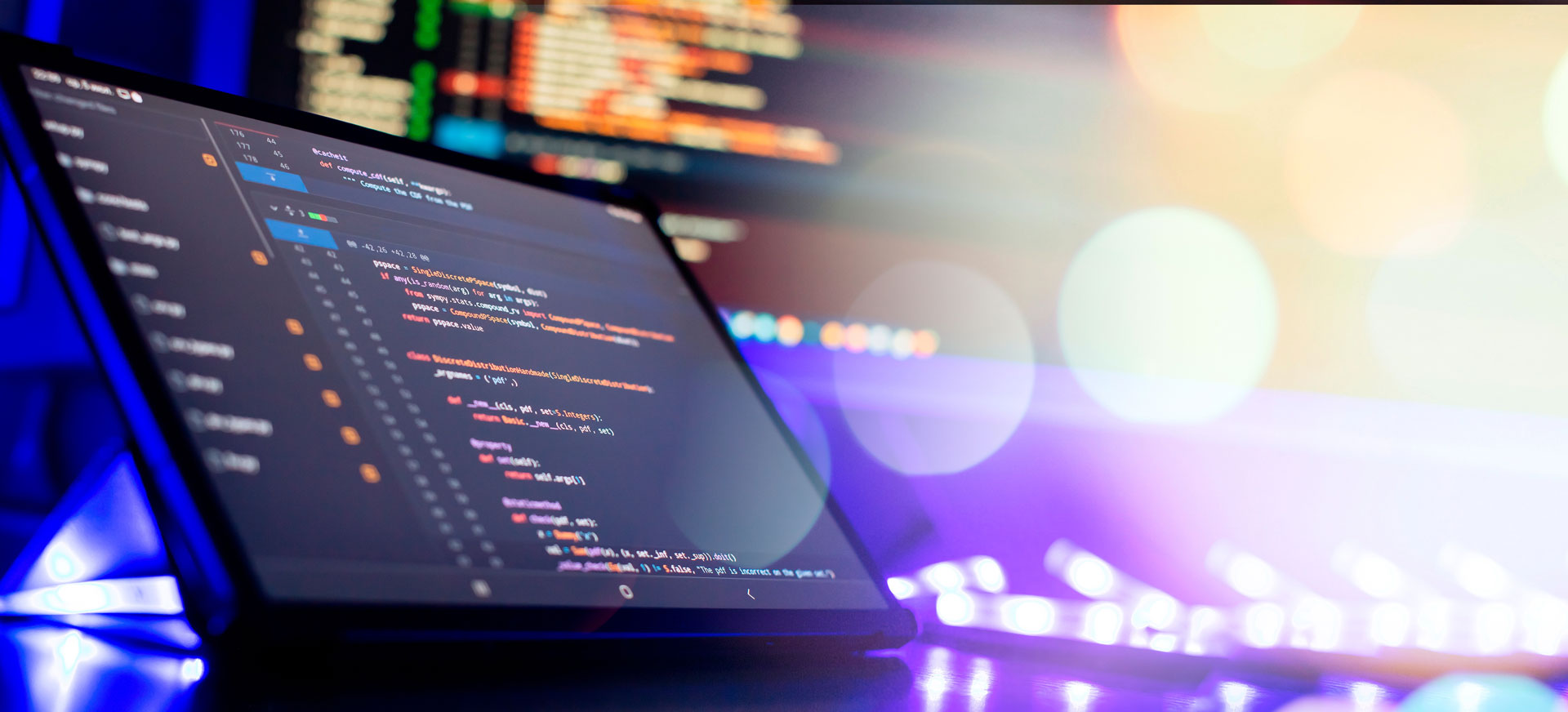 Laptop with code editor on screen