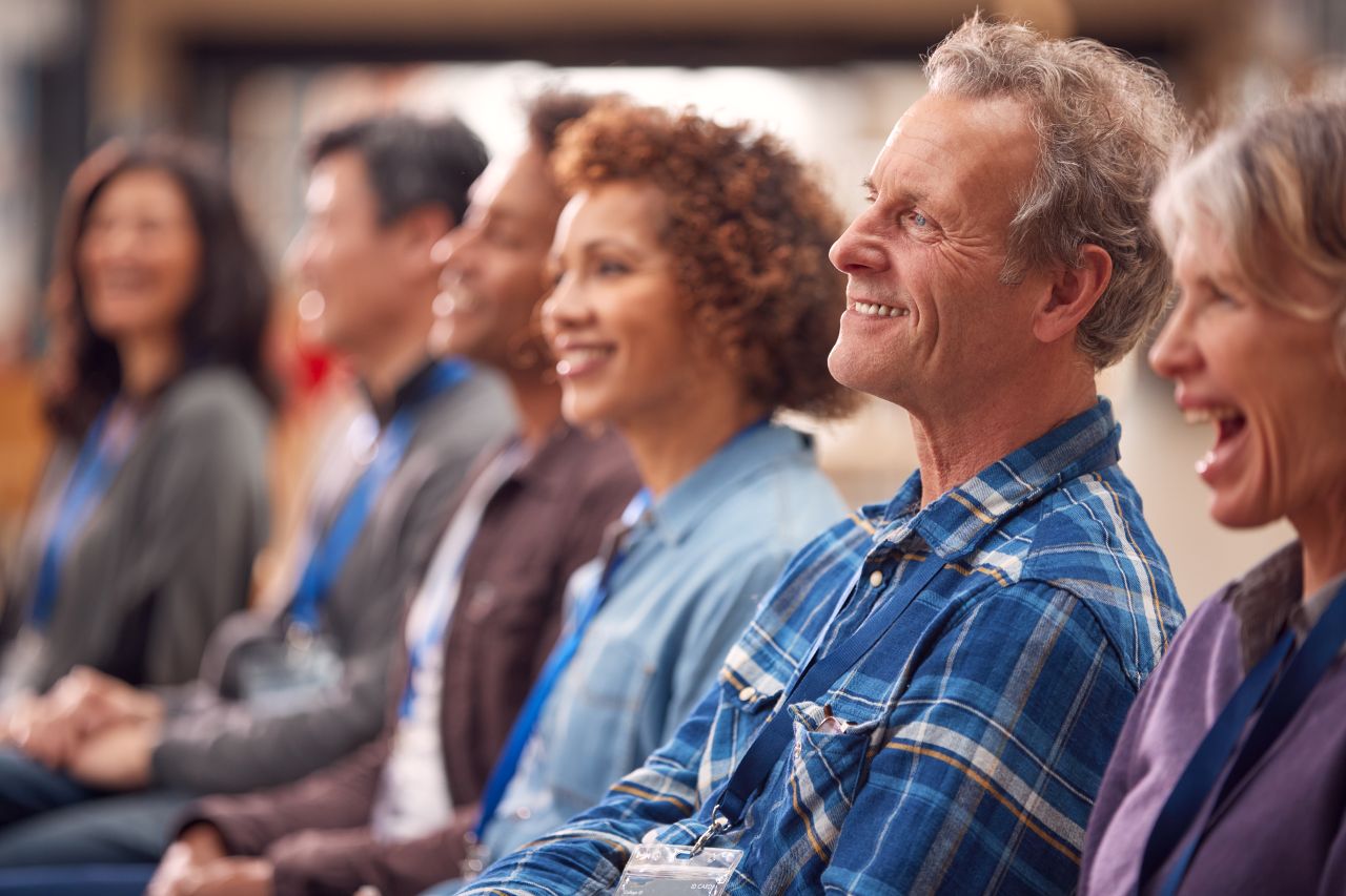 Nonprofit team at conference that needs WordPress Elementor Support