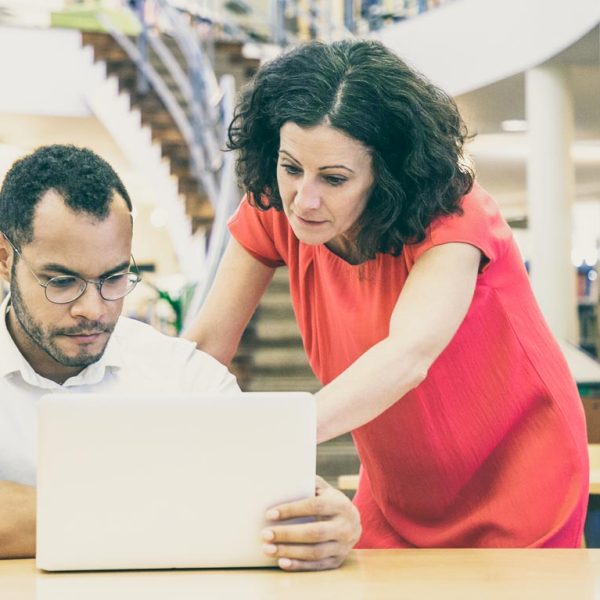 Coworker is helping colleague finding the right information