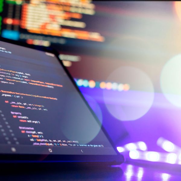 Laptop with code editor on screen